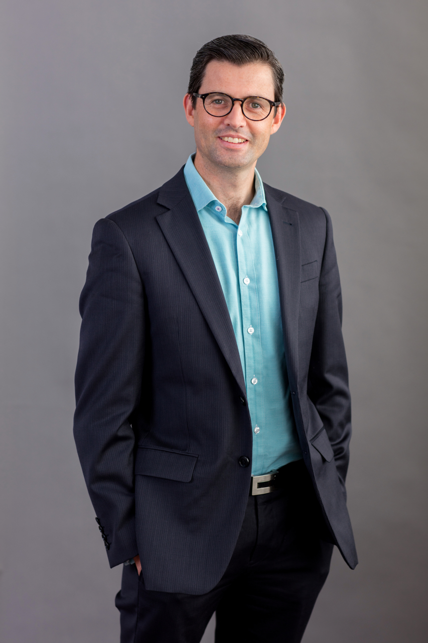 Business headshot on grey background