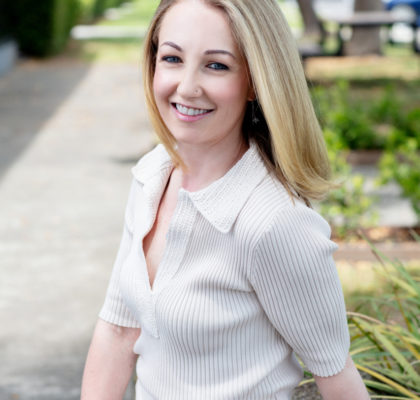 Relaxed outdoor personable professional portrait of a health coach