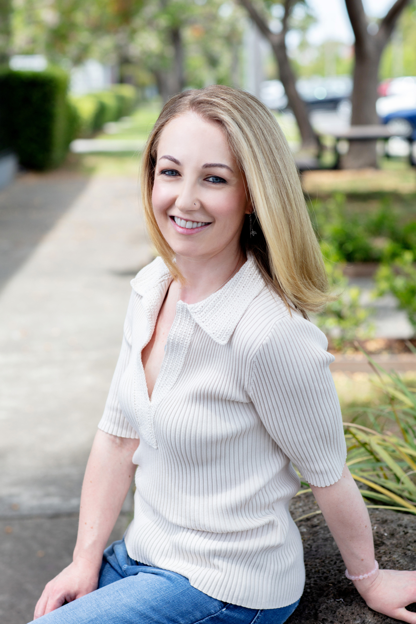 Relaxed outdoor personable professional portrait of a health coach