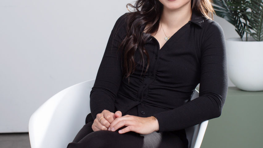 Professional Headshot of a medical professional sitting in a relaxed way in a chair