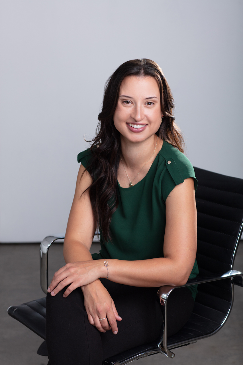 Professional Headshot of a Melbourne Occupational therapist leaning in to camera.